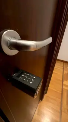 a remote control sticking out of a door at Romerooms Condotti in Rome