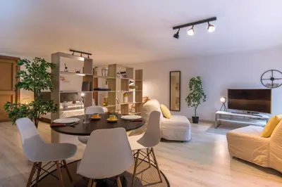 a living room with a table and chairs and a couch at Suite a pochi passi da S. Pietro in Rome