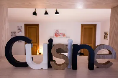 a sign for the word shop in a room at Suite a pochi passi da S. Pietro in Rome