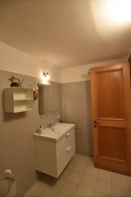 a bathroom with a sink and a mirror at Suite a pochi passi da S. Pietro in Rome