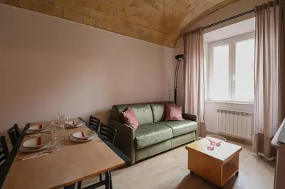 a living room with a couch and a table at [Termini Treasure] - Elegant retreat in Rome