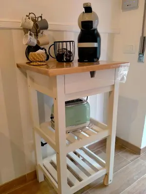 a table with a coffee maker on top of it at The green place alloggio turistico in Rome
