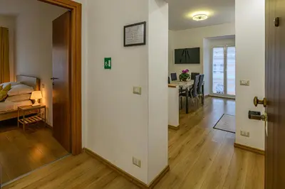a hallway with a living room and a dining room at Domus Dino in Rome