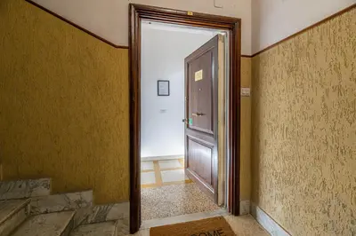 an open door in a room with a hallway at Domus Dino in Rome