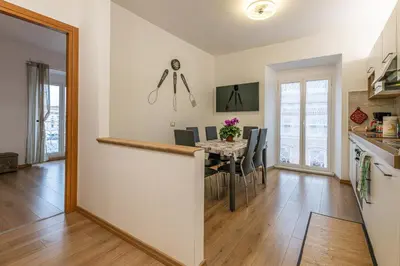 a kitchen and dining room with a table and chairs at Domus Dino in Rome