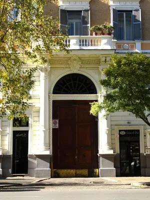 a large building with a large wooden door at Domus Dino in Rome