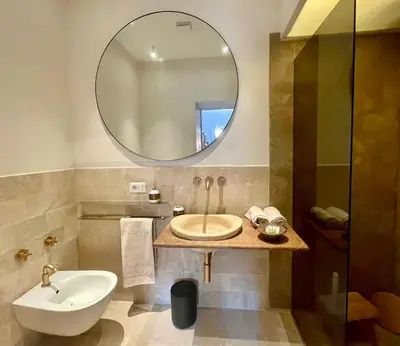 a bathroom with a sink and a mirror at Casa Monti Club in Rome