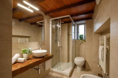 a bathroom with a sink and a shower and a toilet at B5 Apartment Vatican in Rome