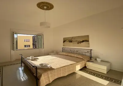 a bedroom with a bed and a window at Dew Vatican Apartment in Rome