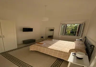 a bedroom with a bed and a window at Dew Vatican Apartment in Rome