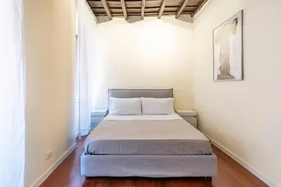 a small bedroom with a bed in a room at Accogliente casa a due passi da Piazza Navona in Rome
