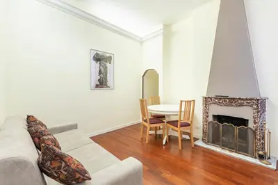 a living room with a couch and a fireplace at Accogliente casa a due passi da Piazza Navona in Rome