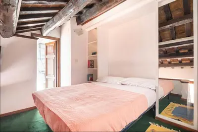 a bedroom with a large bed in a room at Accogliente casa al Pantheon in Rome