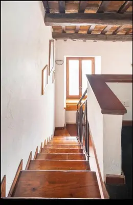 a staircase in a building with a window at Accogliente casa al Pantheon in Rome