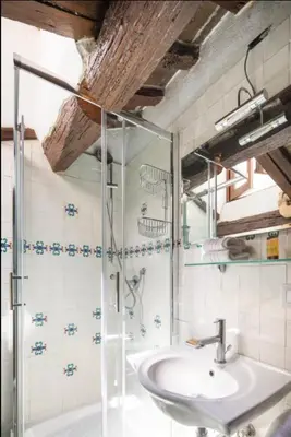 a bathroom with a sink and a shower at Accogliente casa al Pantheon in Rome