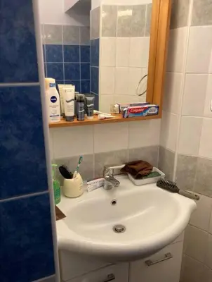 a bathroom with a sink and a mirror at Loft Accogliente - Piazza San Giovanni in Rome