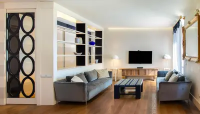 a living room with two couches and a tv at [ROMAN JEWEL] Elegant apartment near the center in Rome