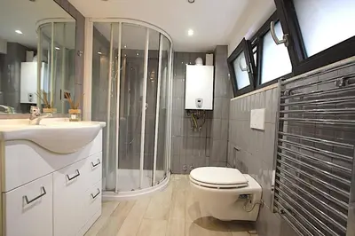 a bathroom with a toilet and a sink and a shower at Ponte Milvio Lovely Studio in Rome