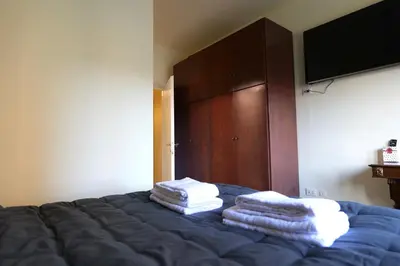 a bedroom with a bed with towels on it at stazione trastevere\u516c\u5bd3 in Rome