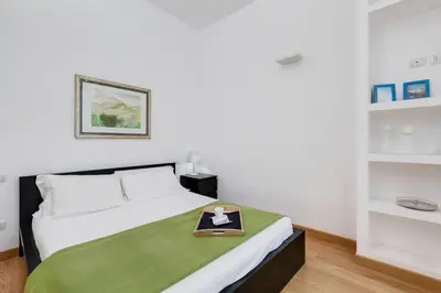 a bedroom with a bed with a tray on it at Incantevole appartamento in pieno centro a Roma in Rome