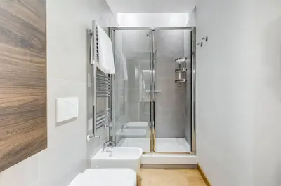 a bathroom with three sinks and a shower at Incantevole appartamento in pieno centro a Roma in Rome