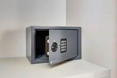 a safe is attached to a wall at MONTI44 Boutique Apartment in Rome