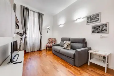 a living room with a couch and a table at MONTI44 Boutique Apartment in Rome