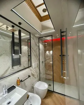 a bathroom with a shower and a toilet and a sink at Z-ArchSuites Urbs in Rome
