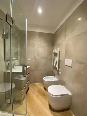a bathroom with a toilet and a sink at Boho Suites - Rome Colosseum in Rome