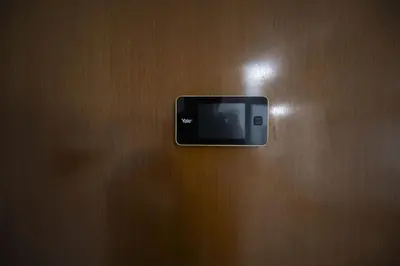 a cell phone hanging on a wooden wall at Lovely Apartment in Hip and Vibrant Pigneto in Rome