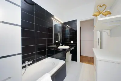 a bathroom with a tub and a sink at Real Vatican Inn in Rome