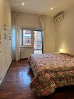 a hotel room with two beds and a window at Goiran@4 in Rome