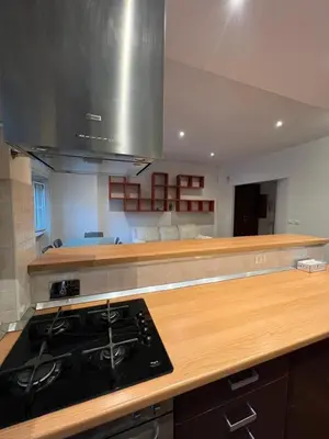 a kitchen with a stove and a counter top at Goiran@4 in Rome