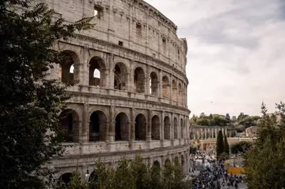 a crowd of people standing around the coliseum at Sweet Roof Rhome in Rome