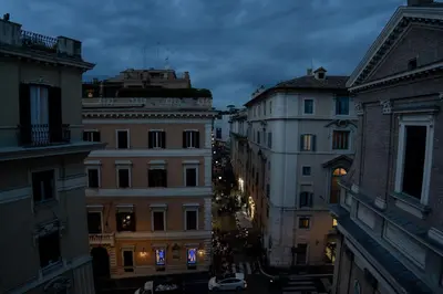 a group of buildings in a city at night at Sweet Roof Rhome in Rome