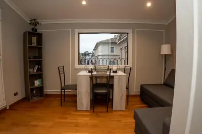 a dining room with a table and a window at Sweet Roof Rhome in Rome