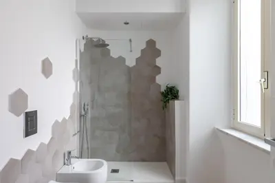 a white bathroom with a shower and a sink at iFlat Sunny & Brand New Apartament near Vatican in Rome