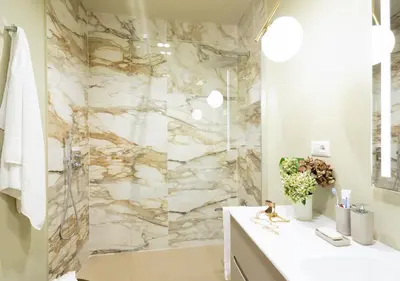 a bathroom with a marble shower and a sink at MAISON CAIO 7 in Rome