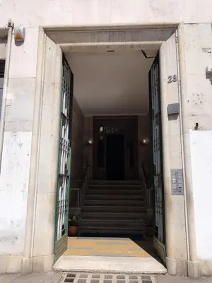 an open door of a building with stairs at The Manzoni in Rome
