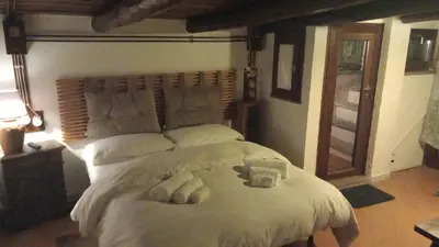 a bedroom with a bed with two teddy bears on it at Casa Greco - Attico con terrazza, Trastevere in Rome