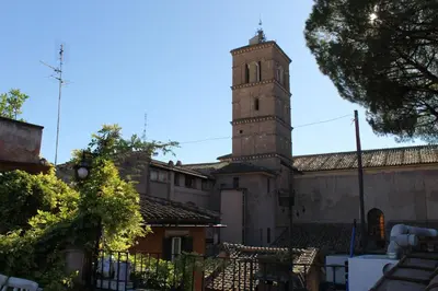 a building with a clock tower in the distance at Casa Greco - Attico con terrazza, Trastevere in Rome