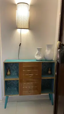 a table with a lamp and two vases on it at Good Time Apartment in Rome