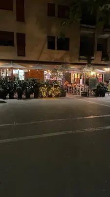 a group of motorcycles parked in front of a building at Good Time Apartment in Rome