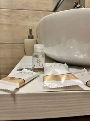 a bathroom counter with a sink and a bottle of soap at 450mt to Basilica S.Pietro in Rome