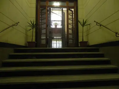 a set of stairs with a door in a building at Vica Pota in Rome