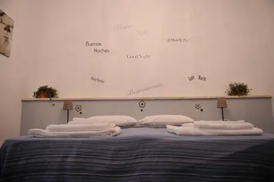 a bedroom with a bed with towels on it at Vica Pota in Rome