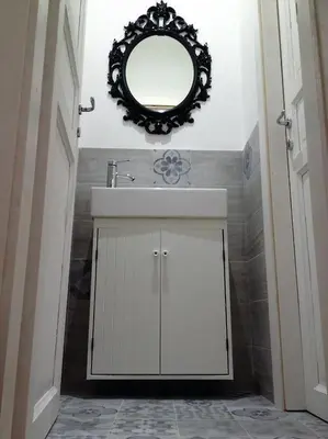 a bathroom with a sink and a mirror on the wall at VATICAN CITY 76 Apartment in Rome