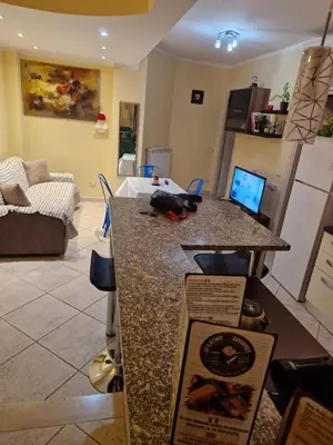 a kitchen and living room with a counter top at casa alibrandi in Rome