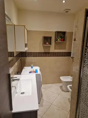 a bathroom with a sink and a toilet at casa alibrandi in Rome