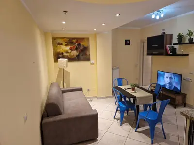 a living room with a couch and a table at casa alibrandi in Rome
